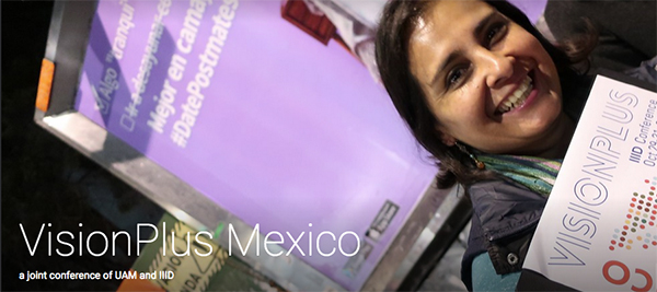 Participant at Vision Plus 2018 in Mexico holding the programme folder